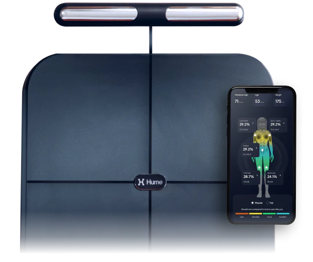 Hume Body Pod scale with handlebar sensor and smartphone displaying body composition analysis, showcasing advanced full-body measurement technology.